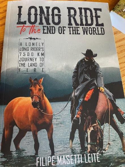 Riders galloping across stunning Wyoming wilderness