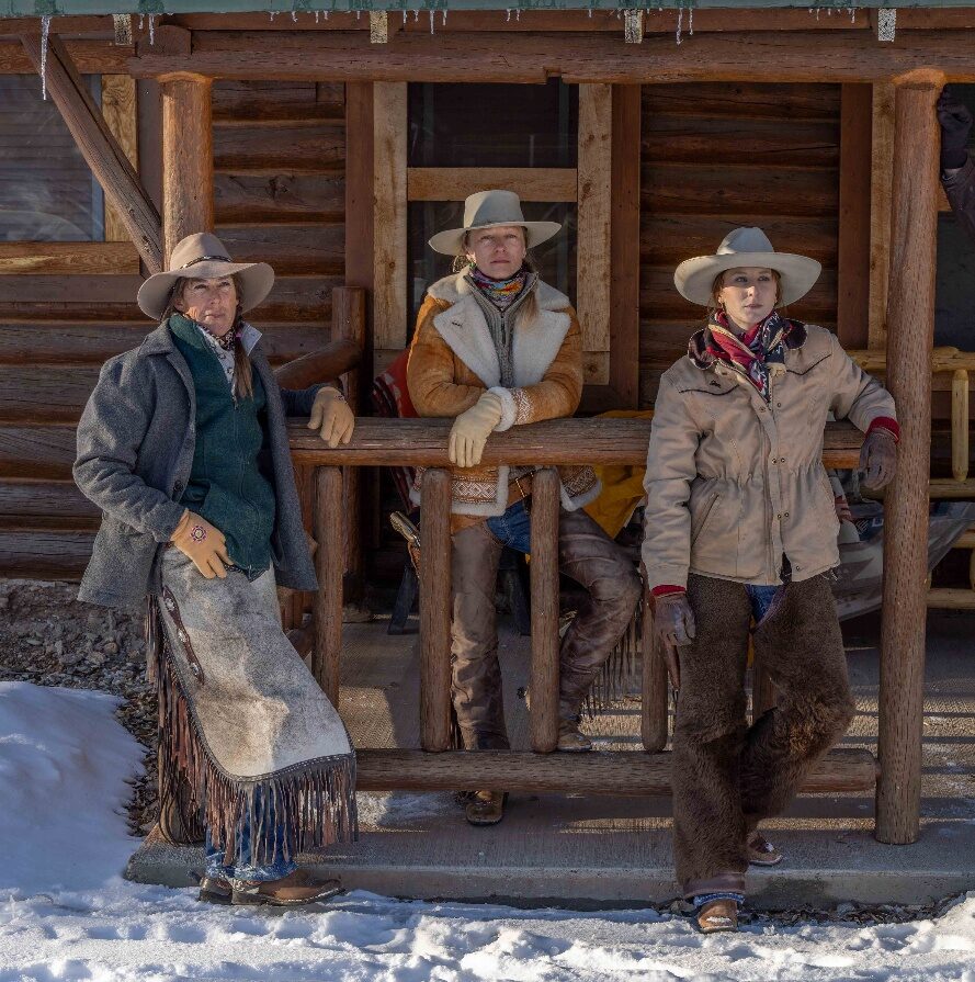 Guests standing outside a ranch building